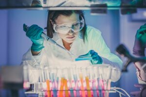 Scientist working at the laboratory using pipette