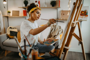 Girl painting on canvas