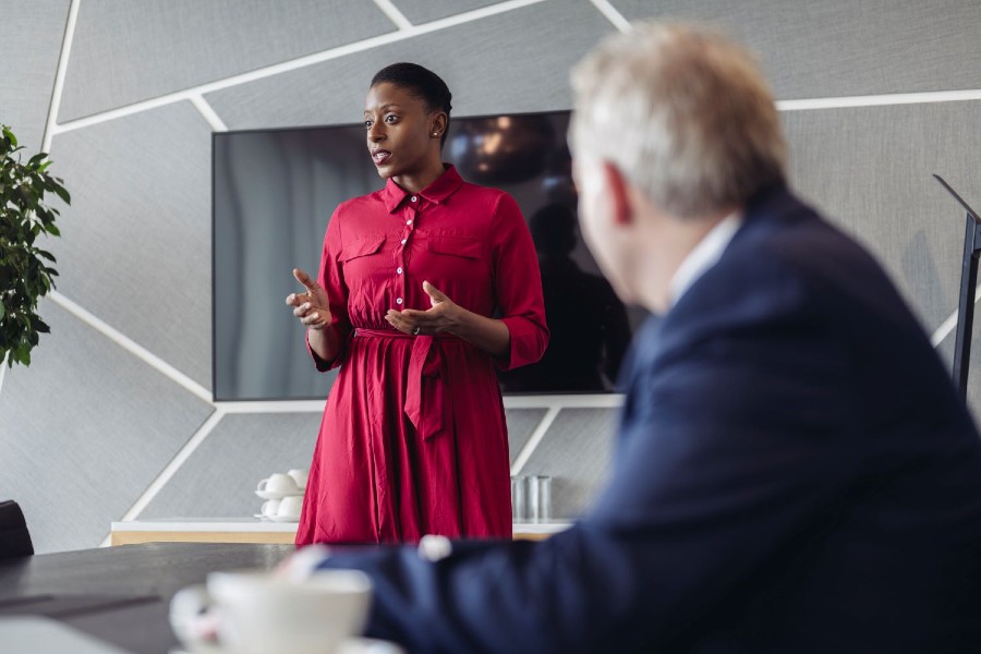 Businesswoman presenting ideas to investment team