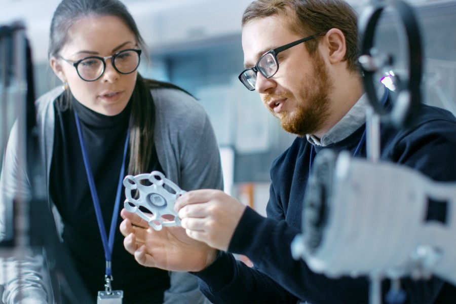  Engineers in a modern laboratory discussing prototype