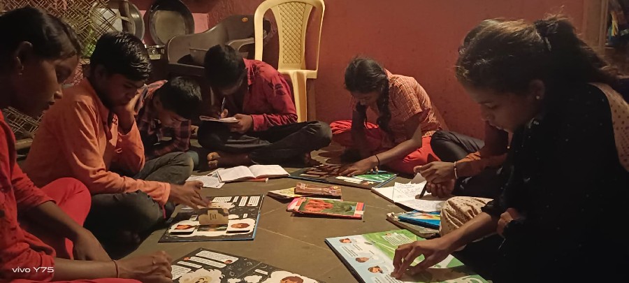 Group of Children reading their Listen to the Universe books