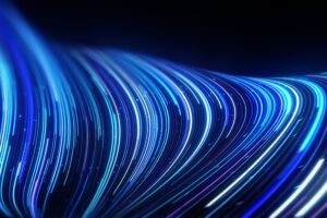 Abstract lines flowing dynamic pattern in blue colors on black background