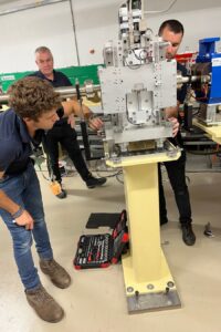 Two people working on the ZEPTO magnet