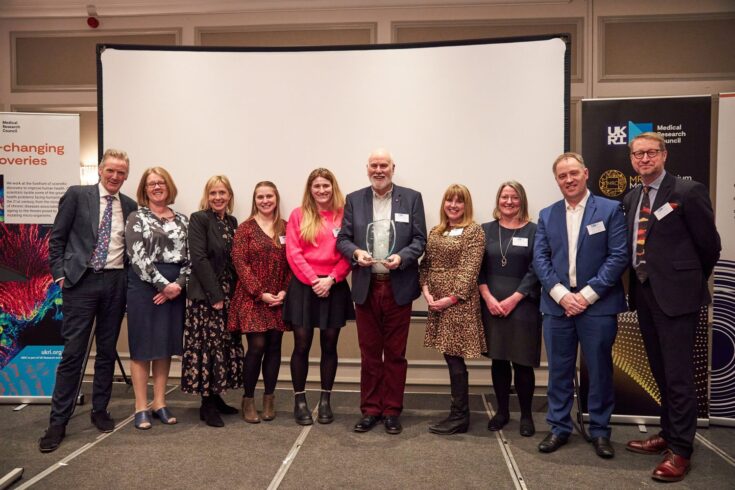 The COMET Initiative Team receiving the MRC Open Science Impact Prize 2022 at the MRC Prizes 2022 Awards Ceremony