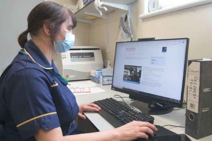 A nurse looks at the RECOVERY trial website