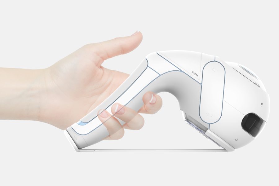 Hand holding a modern scanner device