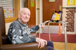 Ronald (93) helps Care City test a prototype of the Dorothy App