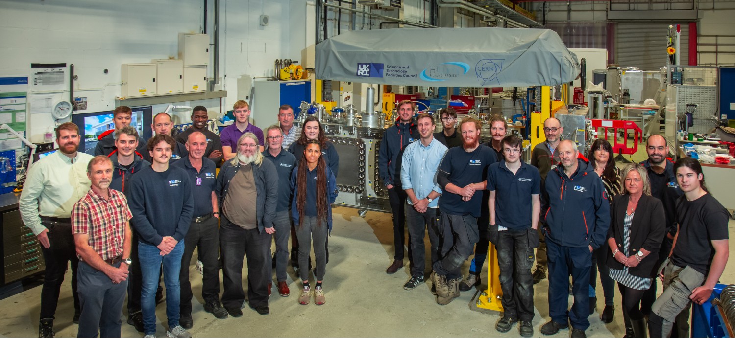 Two groups of people stood in a laboratory space