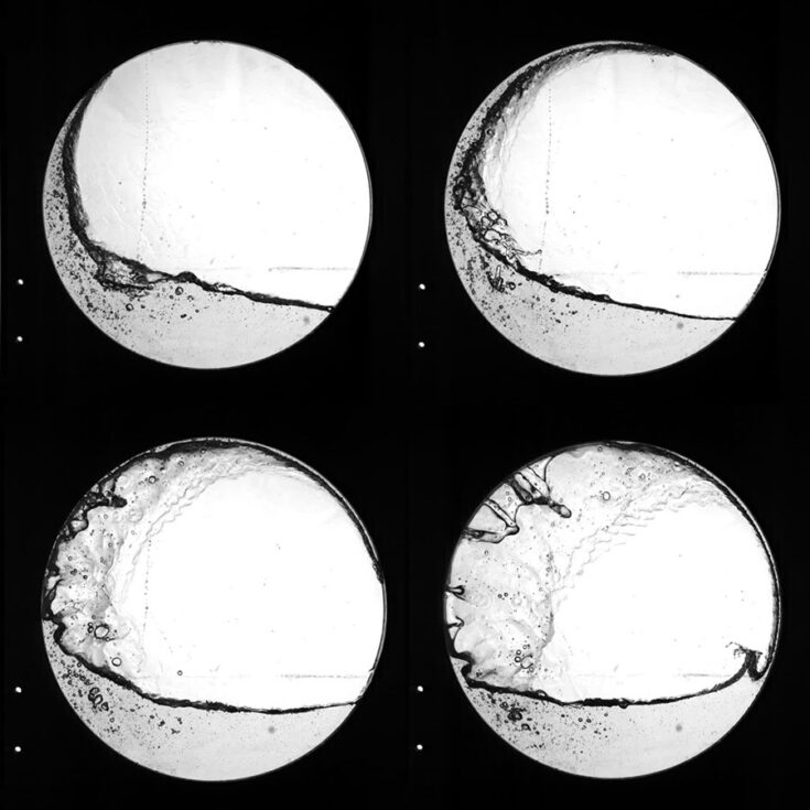 Fluid jet displayed travelling around left-hand side of the geometry circumference (images one (top left), two (top right) and three (bottom left)) before impacting the liquid column on the right-hand side (image four (bottom right)).