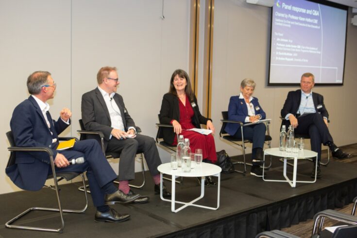 Panel members sat in a line at the launch of the Pathways to Success report in 2023.