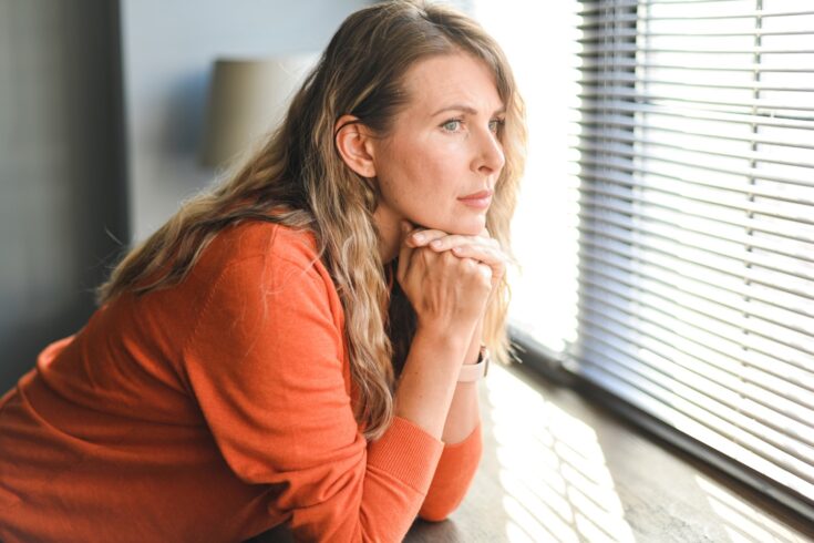 Woman looking out the window