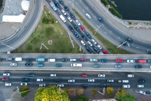 Aerial view of a road junction with heavy traffic.