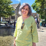 Photograph of Professor Parvati Raghuram standing outside and smiling