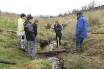 University of Leeds student and staff volunteers building leaky dams in November 2019.