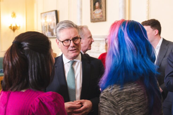 Prime Minister Kier Starmer talking to two women at the Women in Innovation event