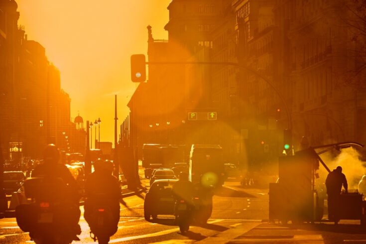 Pollution in Madrid city centre streets showing urban traffic downtown.